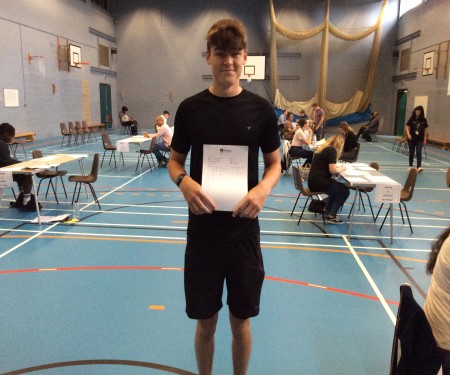 Boy with GCSE results