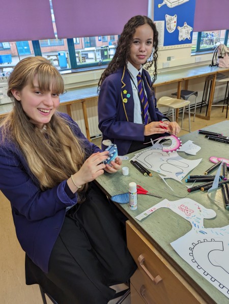 Students with their shoe designs
