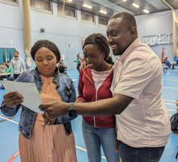 Parents and student with exam results