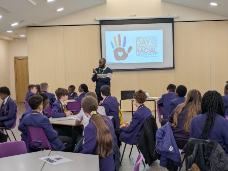 Paul Olubayo delivers an anti-racism workshop for students
